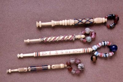 Four beaded bobbins, late 19th century by English School